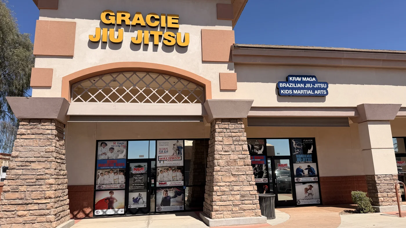 The front of Next Level Fitness and Martial Arts on S Gilbert Rd, with the Gracie Jiu-Jitsu sign above the doors